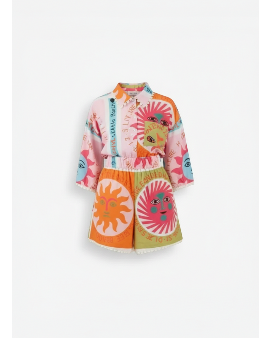 ANN Y two-piece set with sun and text print, featuring a pink top and orange/green shorts with lace trim.