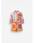 ANN Y two-piece set with sun and text print, featuring a pink top and orange/green shorts with lace trim.