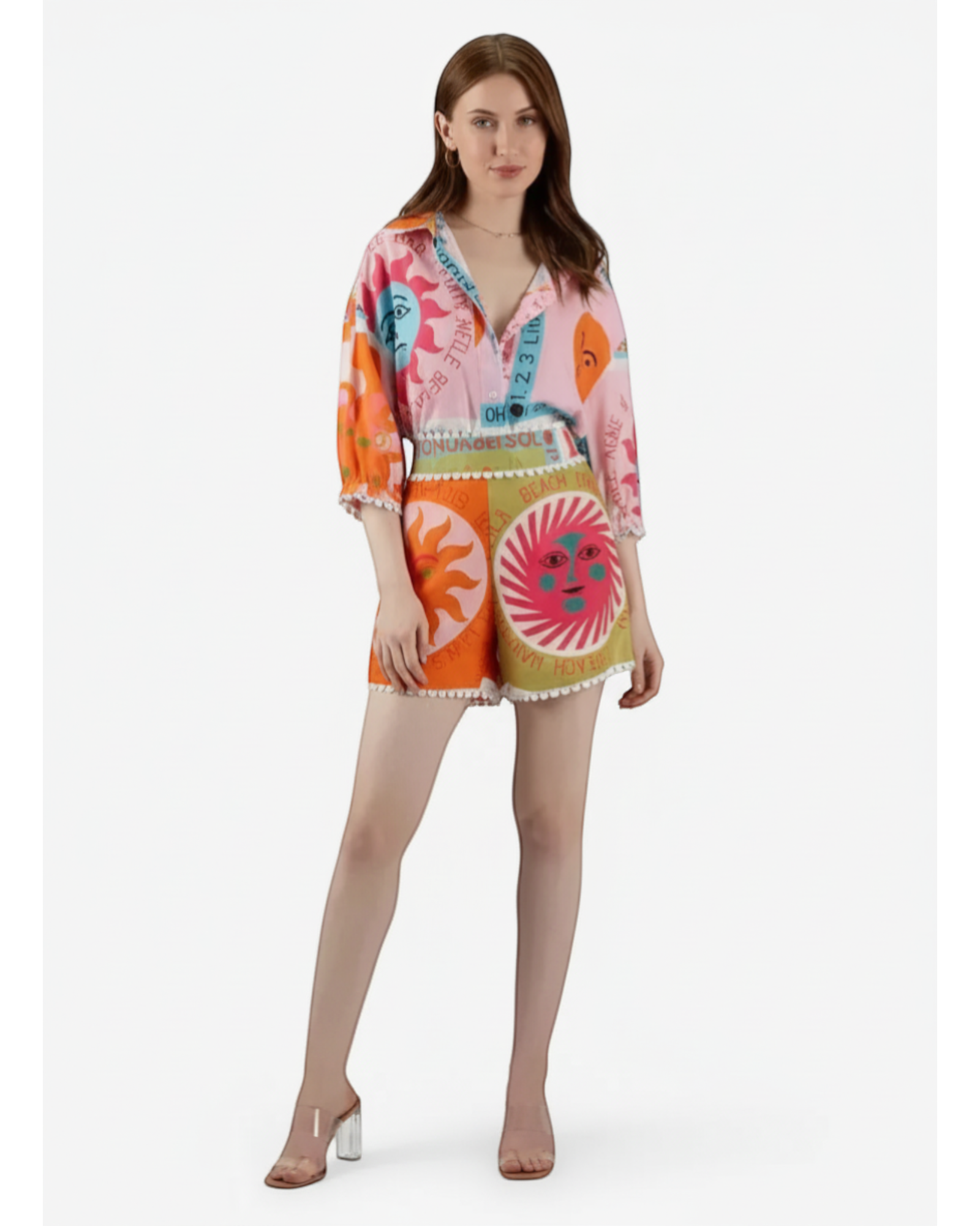 ANNYS colorful graphic print two-piece set with sun and face motifs, featuring a button-up shirt and shorts with lace trim.