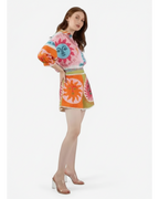 ANNYS pink and orange two-piece set with sun print, featuring a collared shirt with puff sleeves and shorts with an elasticated waistband.