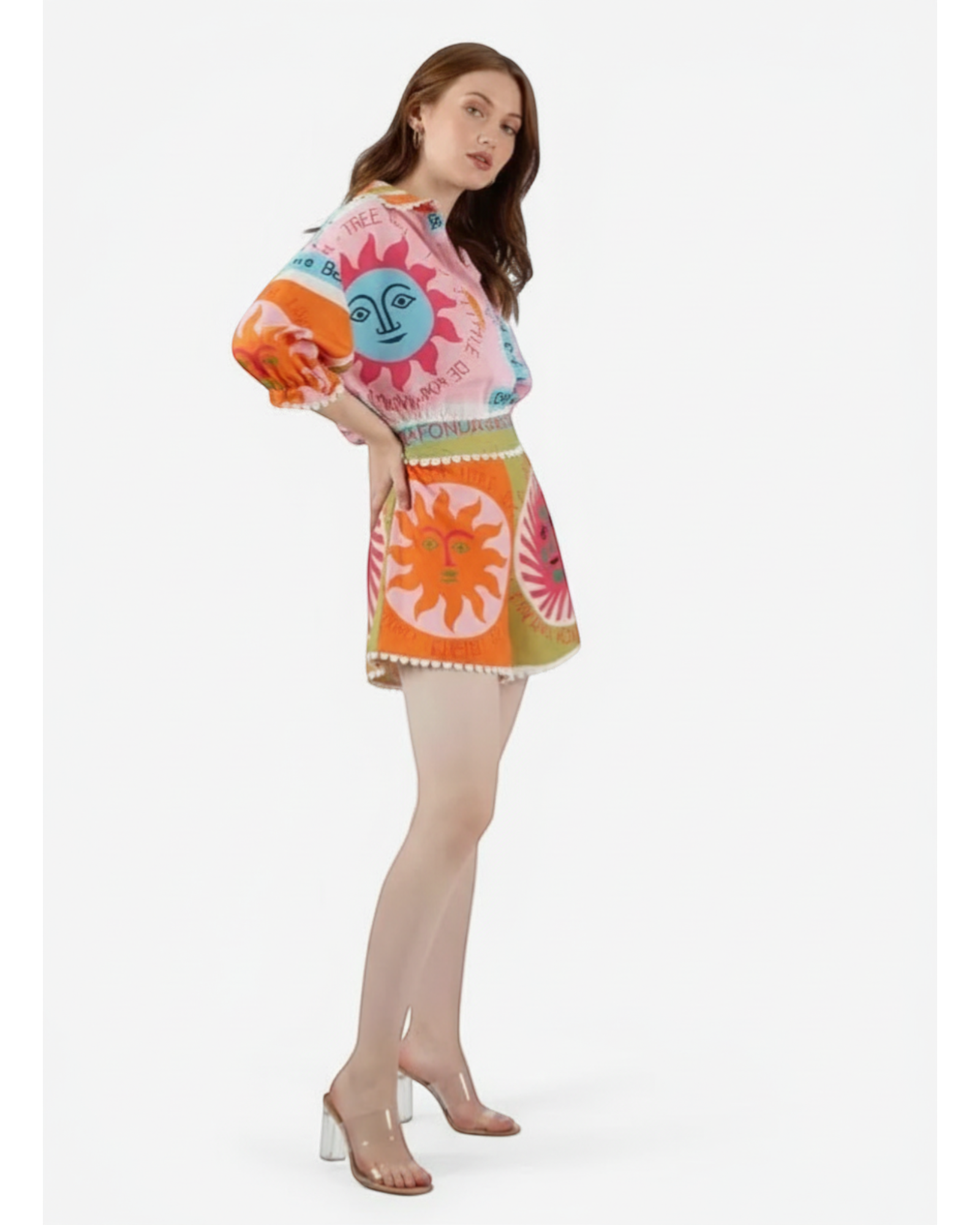 ANNYS pink and orange two-piece set with sun print, featuring a collared shirt with puff sleeves and shorts with an elasticated waistband.